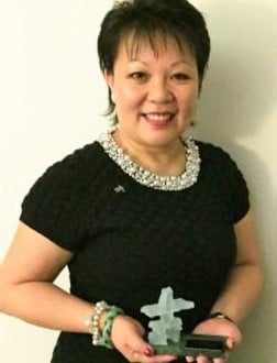Linda Chu holding the Harold Taylor Award