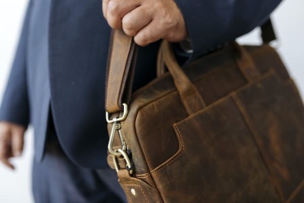 person with briefcase moving back to office