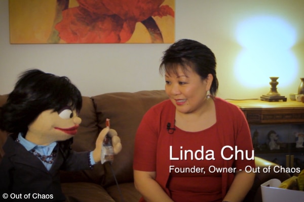 Lil' Chu and Linda Chu sitting on a sofa discussing how to organize spices