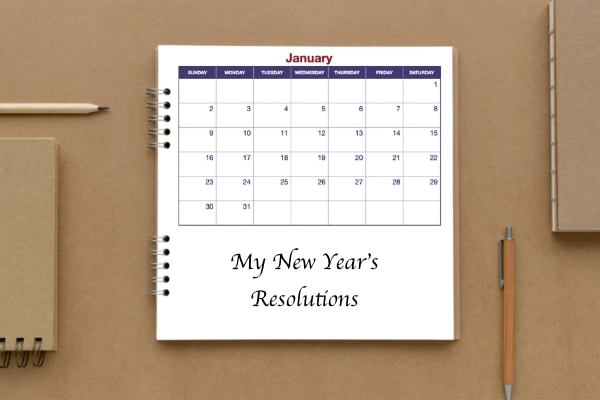 calendar in book showing month of January signifying re-examining SMART acronym for new year's resolutions