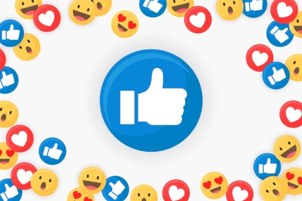 use social media effectively with big thumbs-up buttons surrounded by emojis