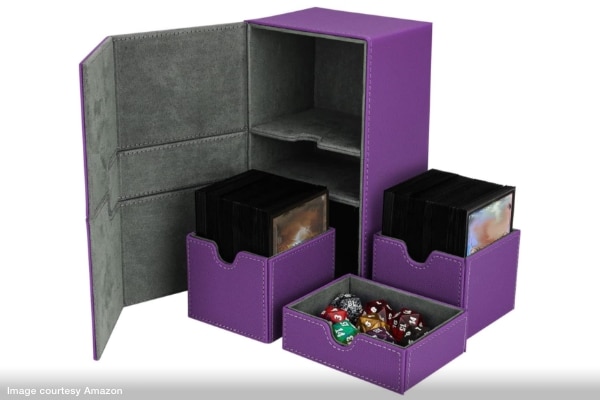 A faux-leather box with flip top lid that holds three drawers, two for gaming cards, another for dice.