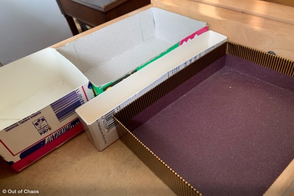 drawer organizers made from cut cardboard boxes showing where to save on organizing products