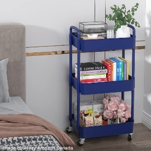 bedside table created with rolling trolley holding books and personal items