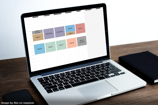 a laptop computer showing the well organized calendar of a productivity pro